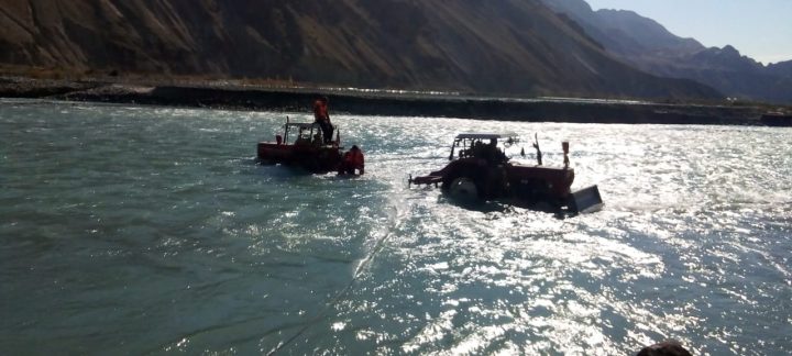 Stranded tractor rescued from river