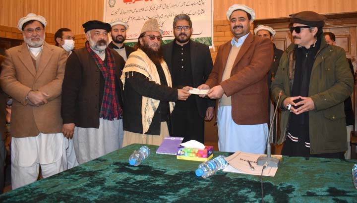Cheques given to prayer leaders, Kalash qazis