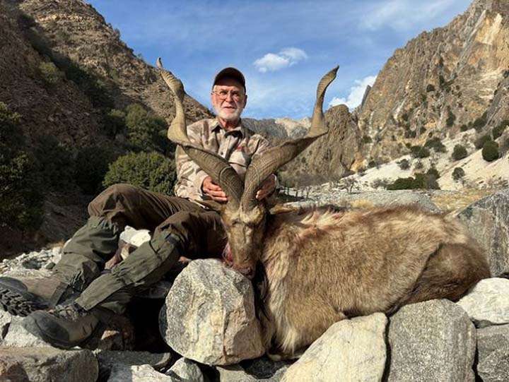 American hunter with his kill in Chitral