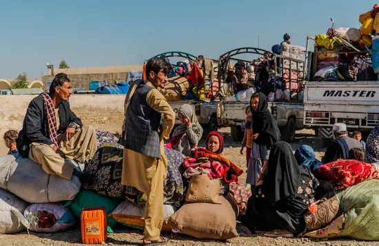 Afghan refugees with their belongings wait for departure to their country in Peshawar. Picture: UNHCR