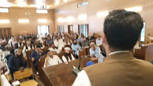 A speaker addresses gathering at launch of late Gujjar poet Abdul Wakeel Soz Khatana’s book at Town Hall Chitral.