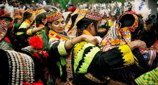 Kalash women in their traditional attire dance during annual Uchal festival in Chitral August 2025.--APP