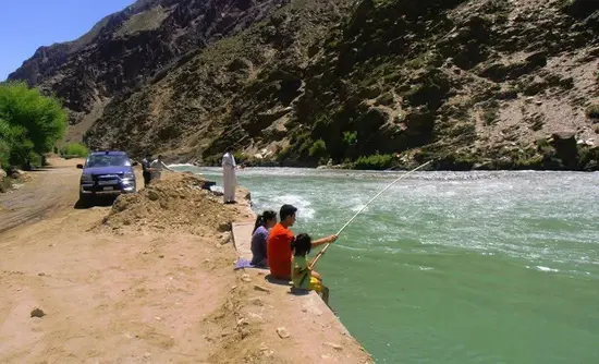 Locals fishing in Garam Chashma river in Droshp village, Lower Chitral.