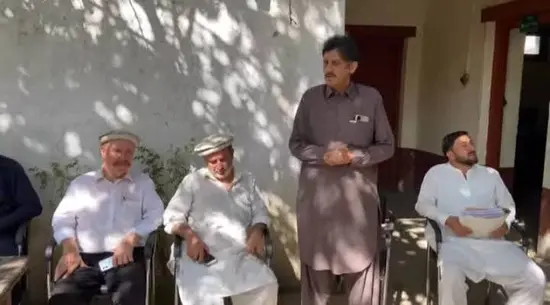 A local resident speaks at a Jirga held in Ayun to press govt to expedite work on Kalash valleys road.