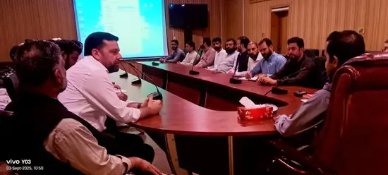 Chitral deputy commissioner Rao Hashim Azeem chairs a meeting about poor telecommunication systems in the district.