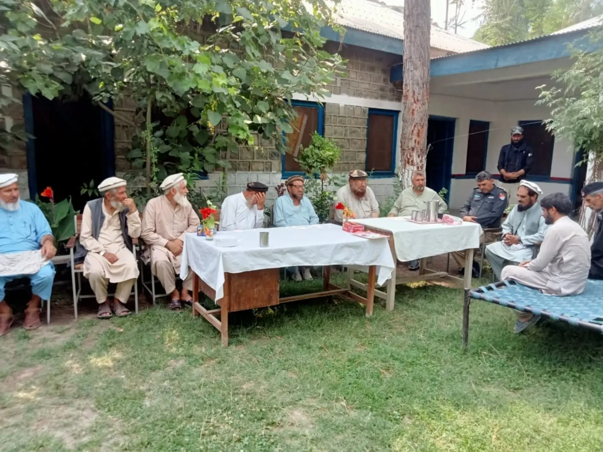Officials of Chitral police and locals of Arandu at a meeting at Arandu police station discuss security measures in border town.