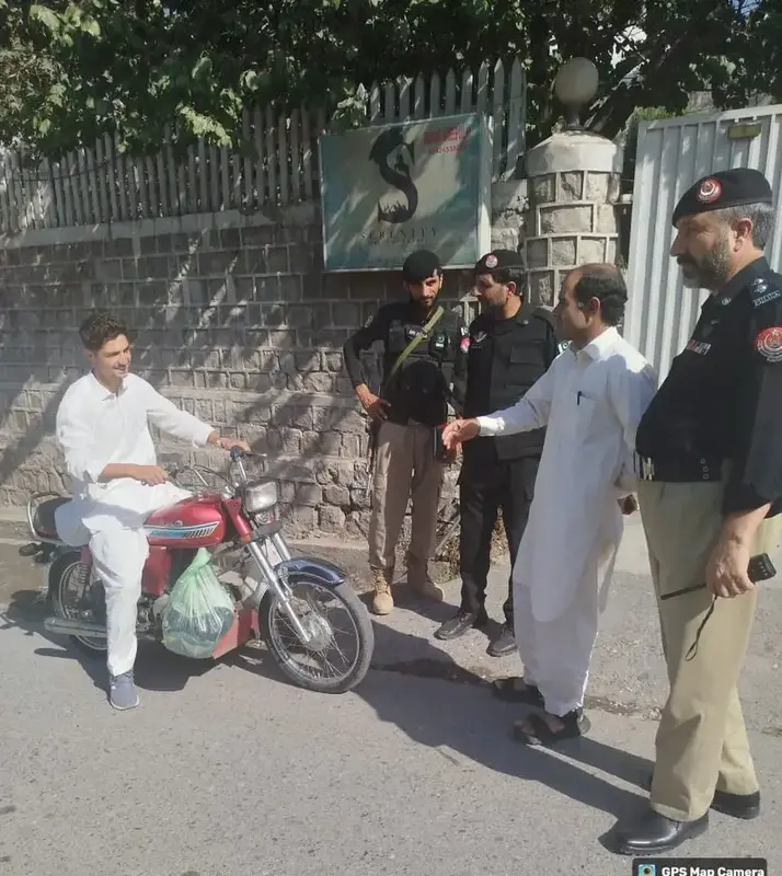 Police stop a bike riders during a crackdown on underage and unlicensed drivers in Drosh, Lower Chitral, Sept 23, 2025.