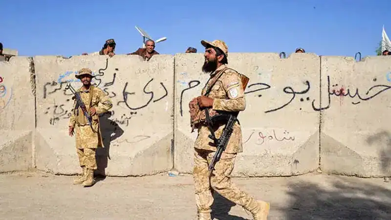 Afghan security forces guard a post along their border with Pakistan.
