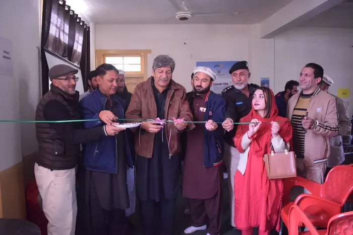 Officials cut ribbon to open Eagle Adventure and Tourism office in Booni Upper Chitral.
