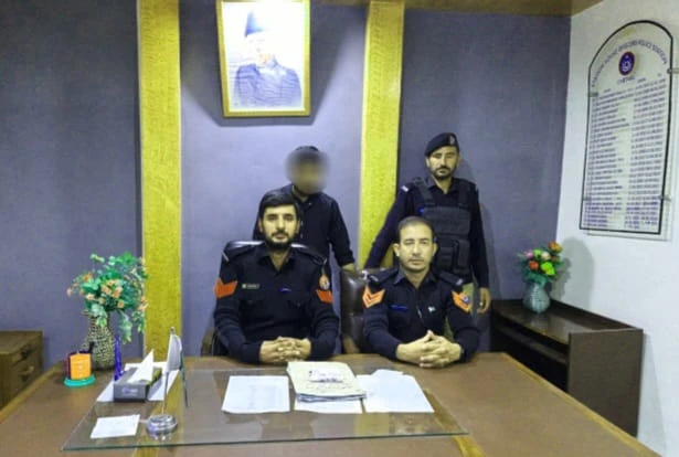 Chitral Police officials with a man after taking him into custody for carrying 61 grams of crystal meth.