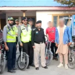 Chitral City police officials with youngsters caught while doing wheelies, on Oct 11, 2025.