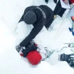 Device test by laying volunteers beneath avalanche.