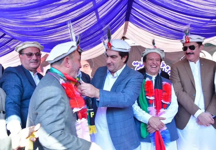 Shahzada Khalid Pervez all smiles at a gathering held in Drosh to return to PPP along with Ghulam Muhamamd on Nov 11, 2025..