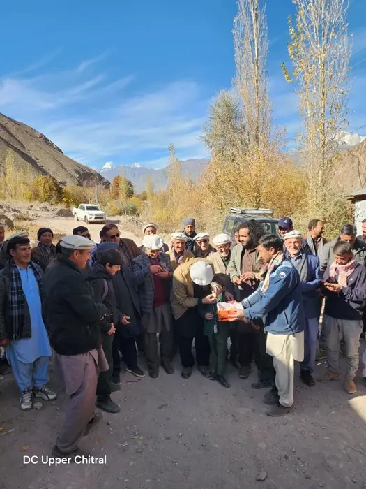 Sweet being distributed at a function held in Booni to start construction on Booni Awi road on Nov 14, 2025.