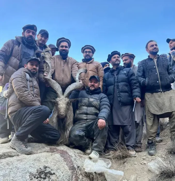 American national Thomas Garrick Steele and locals pictured with the Markhor he killed in Toshi Shaha Lower Chitral on Dec 11, 2025.