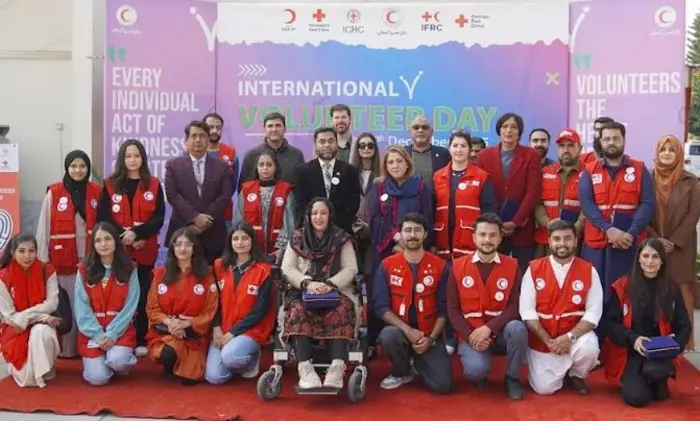 Volunteers pictured with PRCS Chairperson Farzana Naek at a function on International Volunteers Day, Dec 5, 2025, in Islamabad.