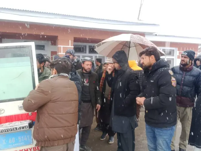 Relatives of injured passengers in Kuragh Charun road accidents gather at THQ Category D hospital in Booni.