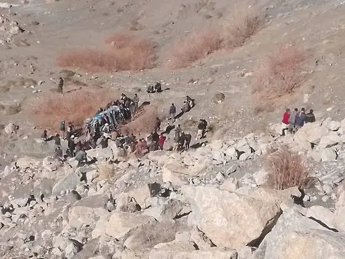 People gather at the place where a jeep fell from Shogram Zom on Jan 15, 2026.