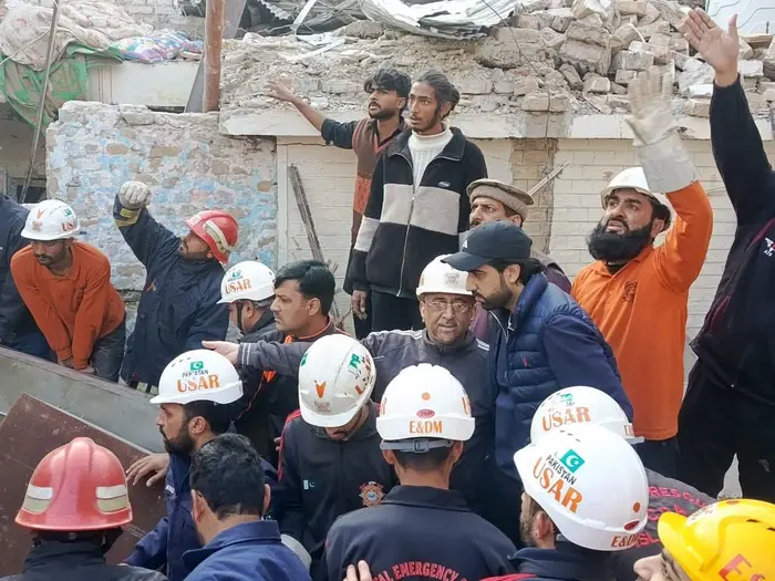 rescues gathered outside a house in G-7/2 Islamabad after a cylinder blast.