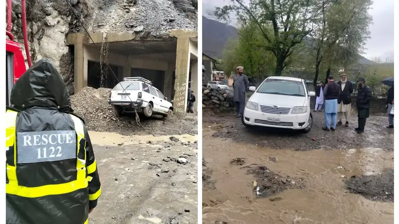 Rescue 1122 staff removes vehicles struck on flooded Garam Chashma road after heavy rain on March 29, 2026.