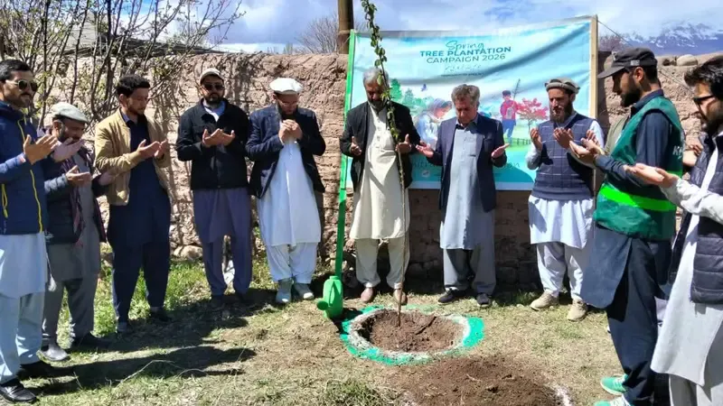 DHO Upper Chitral and AJAH officials plant sapling in Booni.