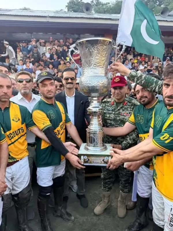 Winning captain receives trophy of pre-Shandur tournament 2026 in Chitral.