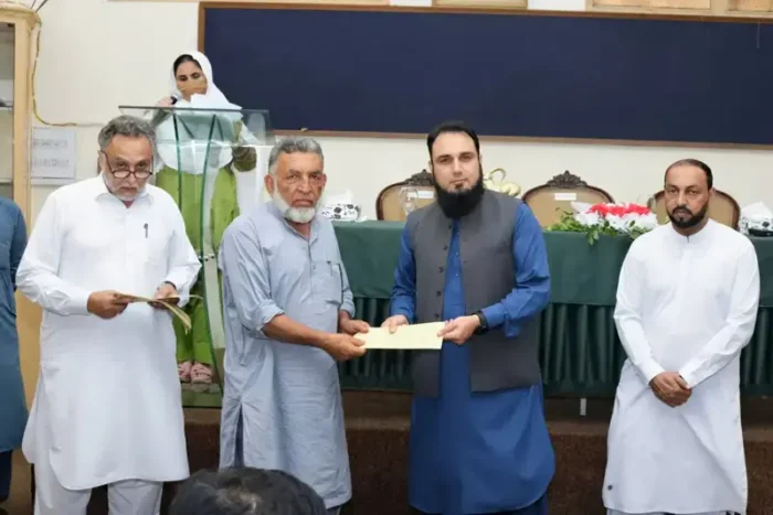 Village conservation committees receive cheques under Ibex Trophy Hunting Program.