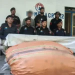 Police officials pictured with two bags of raw opium seized in Zhupu Upper Chitral.