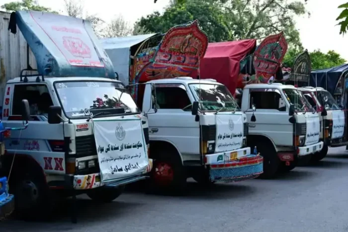 Trucks carrying relief goods sent by Sindh government for Chitral flood victims reach governor house in Peshawar.