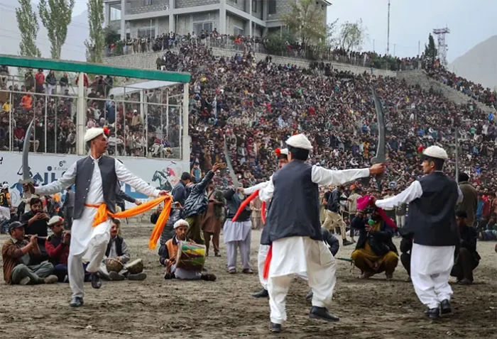 Locals dance at the final of Skardu polo tournament September 29, 2026.