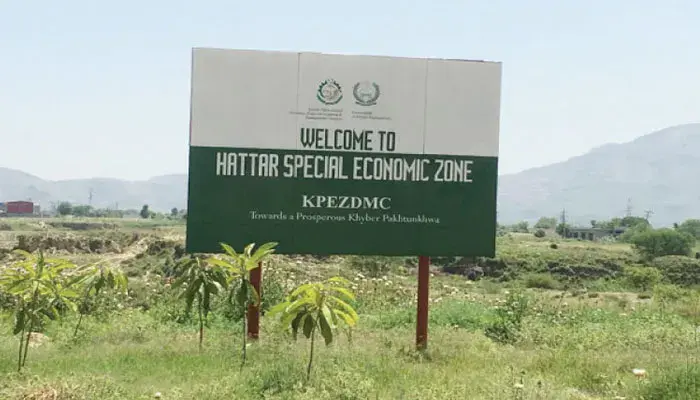 A board shows site for Hattar industrial zone in KP.